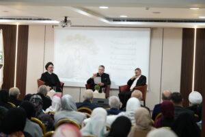 USAL faculty members and attendees engaging in a discussion on human spiritual values during a meeting.