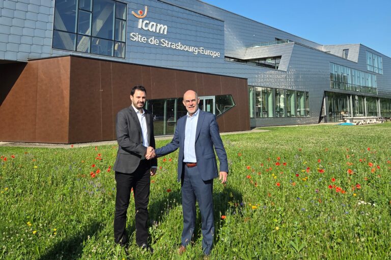 Representatives signing academic and international partnership agreements at the USAL University campus in Lebanon with faculty members and students present.