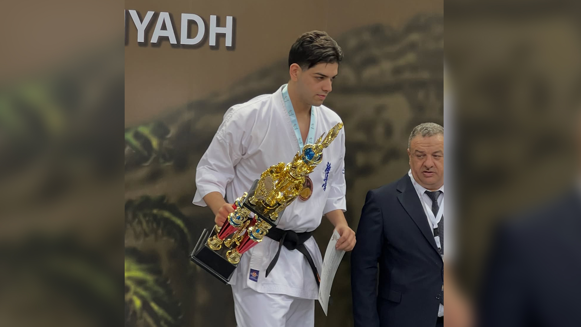Student Hadi Shams from USAL University in Lebanon holding a medal after winning third place in the Kyokushin World Championship karate competition