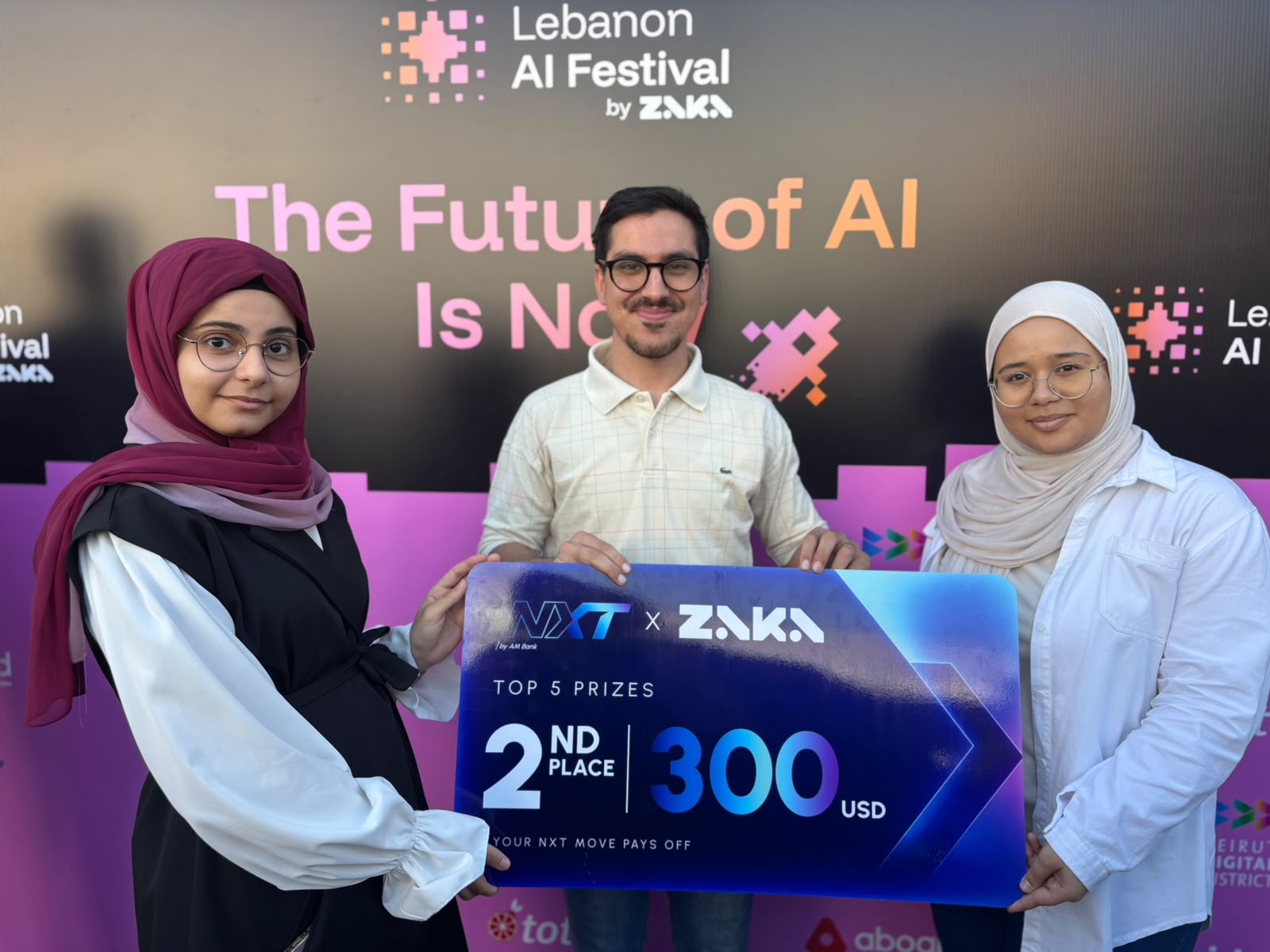 USAL graduate Fatima Fakih holding her 2nd-place award at the Lebanon AI Festival organized by Zaka AI.