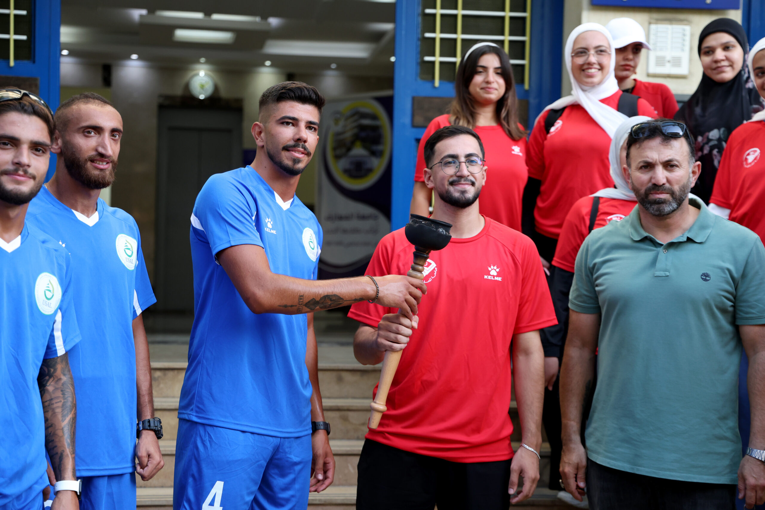 USAL team receives the sports torch during Lebanese Sports Week 2026